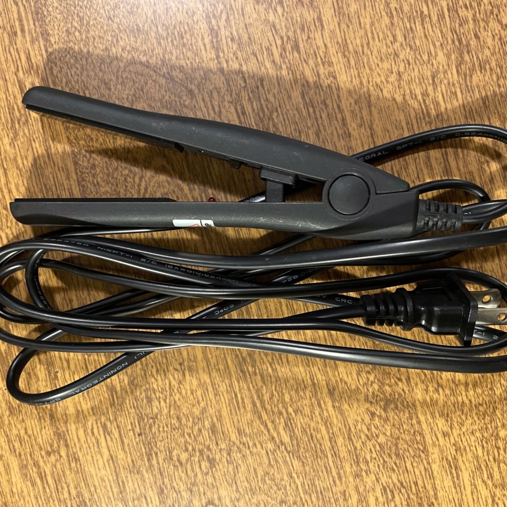 Mini Flat Iron.  Perfect for travel/ touch ups on the go
